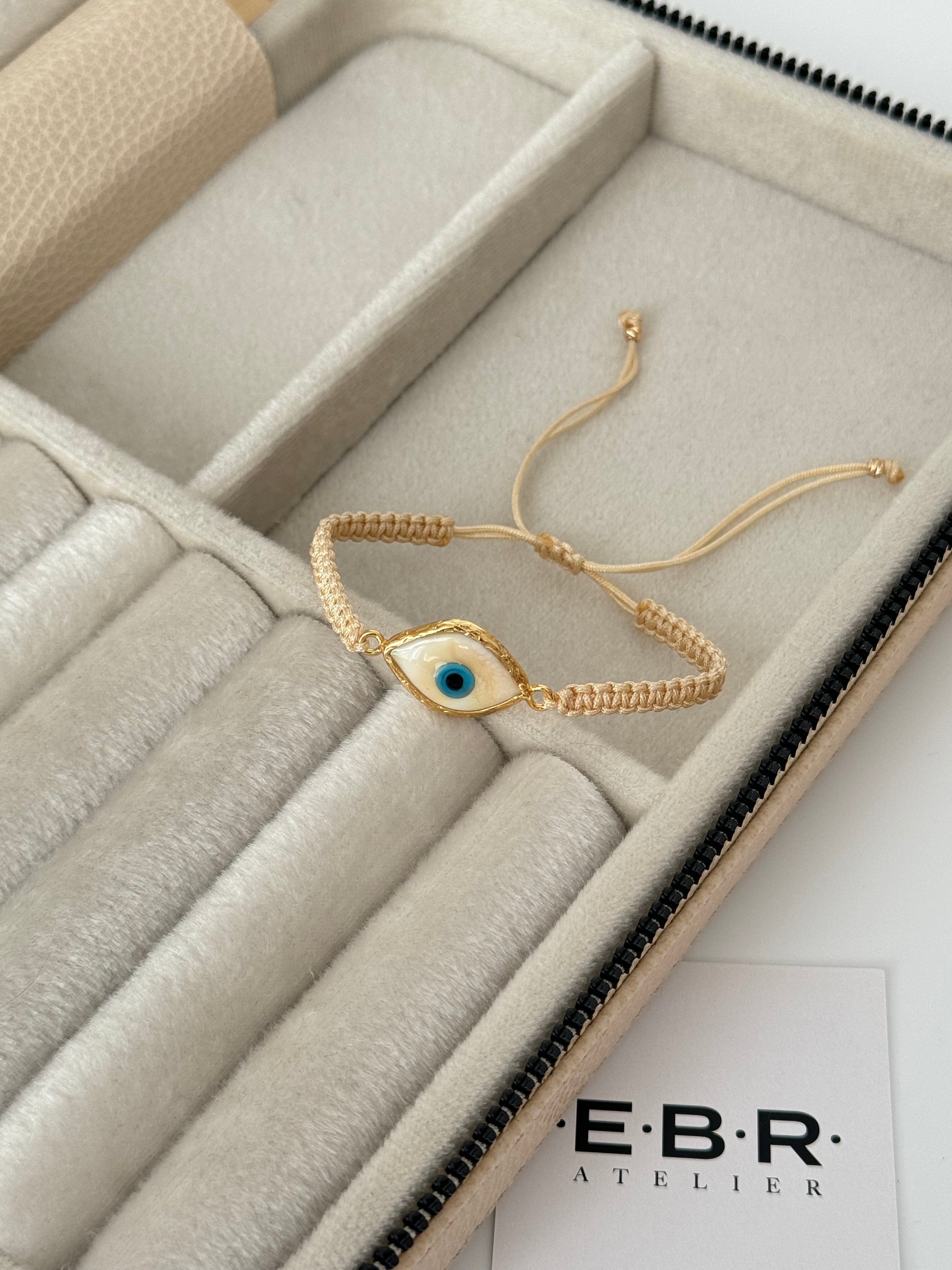 ENA KREM CAM NAZAR BONCUKLU ALTIN KAPLAMA DETAYLI İPLİ BİLEKLİK