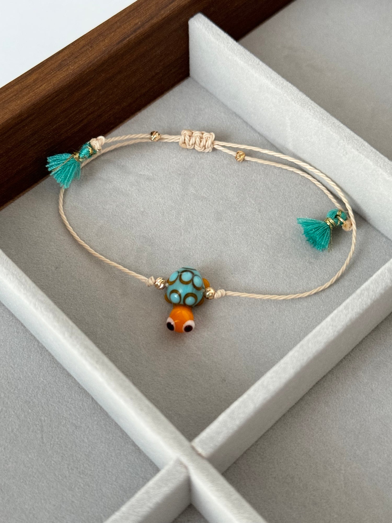 KAPLUMBAĞA CAM BONCUK EL YAPIMI İPLİ BİLEKLİK