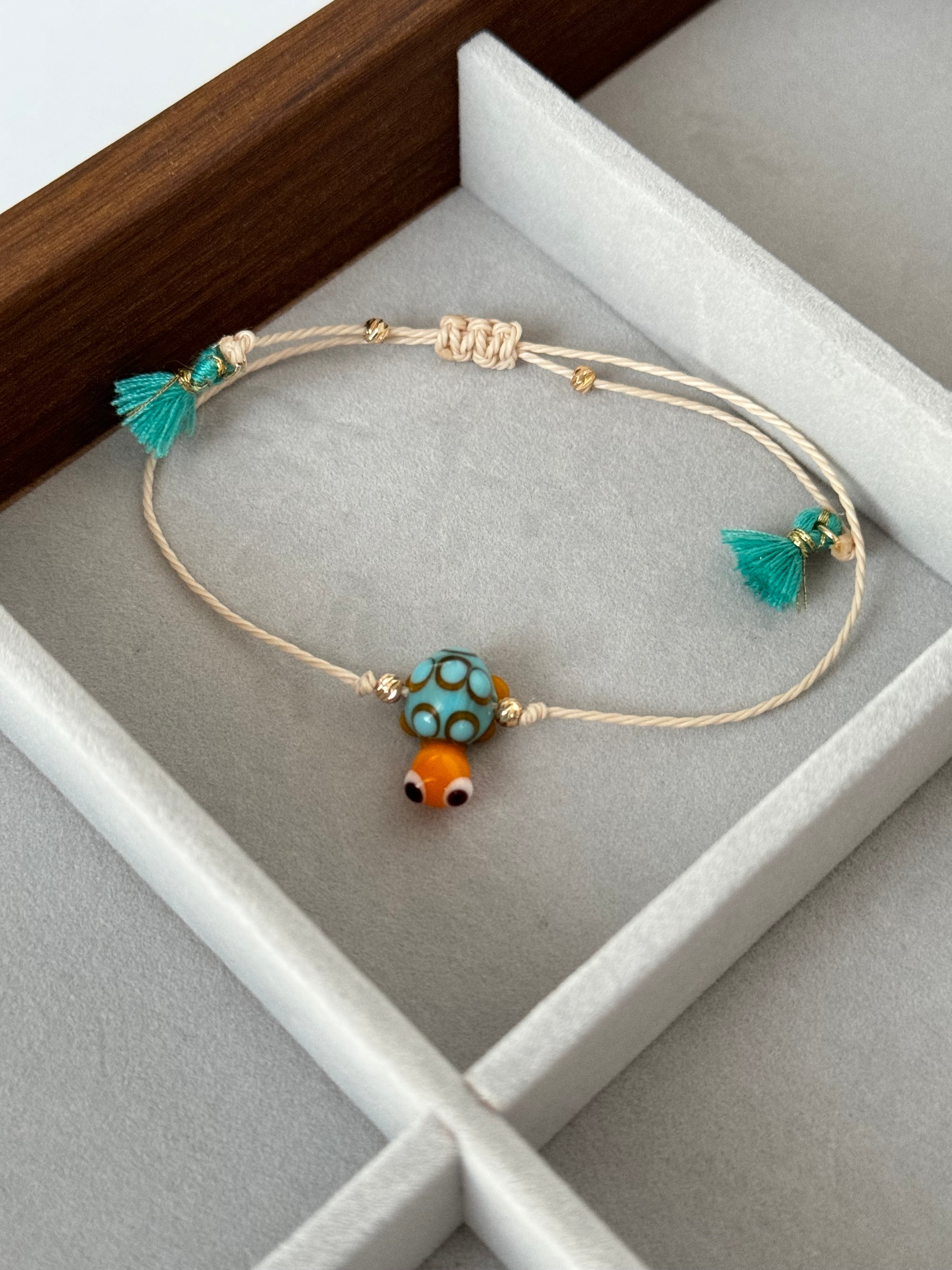 KAPLUMBAĞA CAM BONCUK EL YAPIMI İPLİ BİLEKLİK